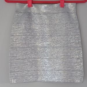 NWOT bebe silver metallic skirt.